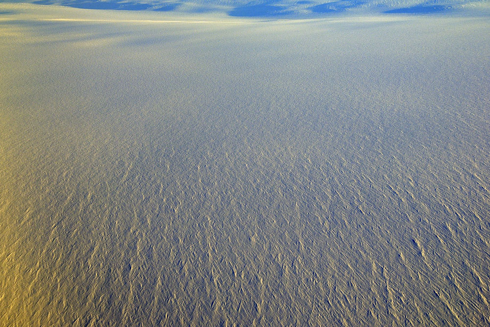 Desolate icecap stretches seemingly without end to the horizon