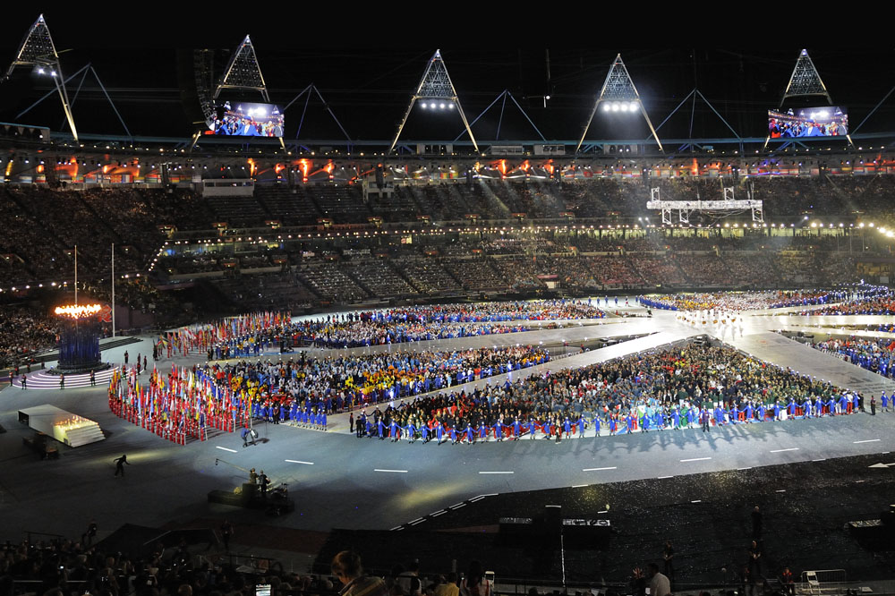 Athletes and flags in stadium at Closing Ceremony