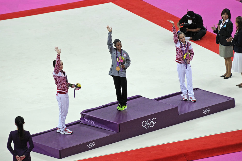 Gabby Douglas waives to crowd at Medal Ceremony