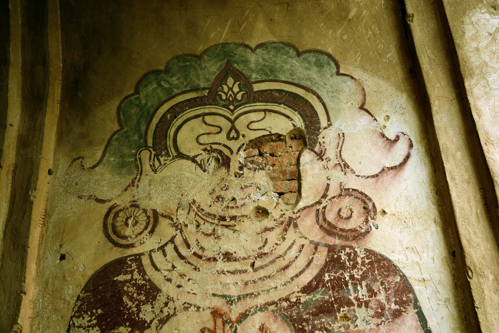 Artwork on interior wall of Buddhist shrine
