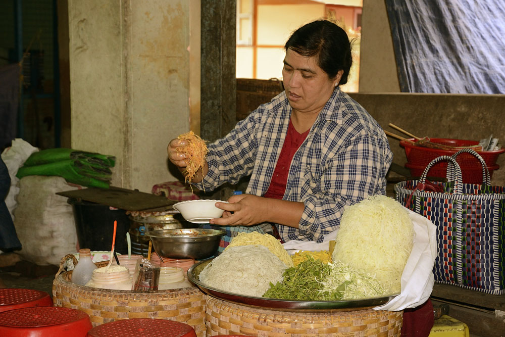 Woman preparing food for visitors to the monastery