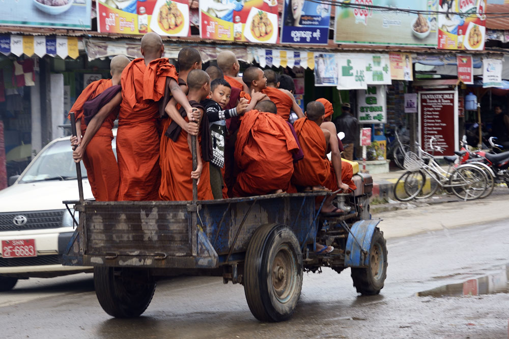 Monks in a truck with boy