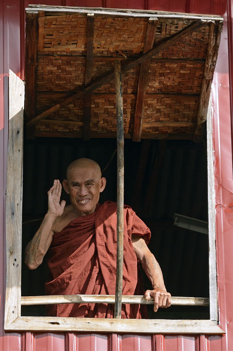 Monk waiving to us from window