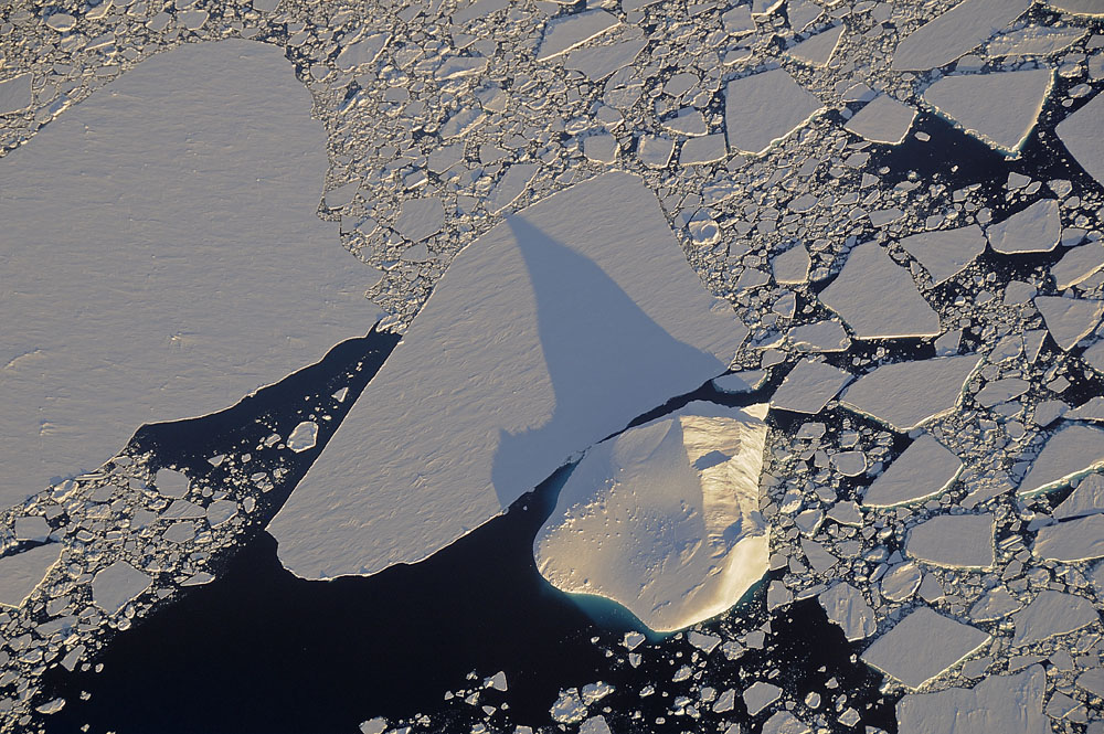 Iceberg with blue visible below surface