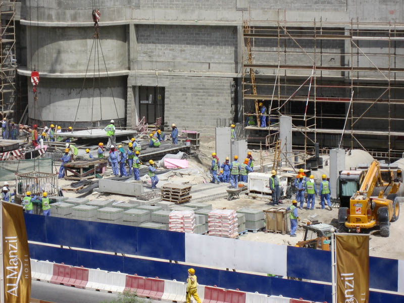 Men at Work at Construction Site near base of Burj Dubai