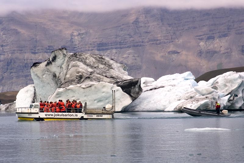 Jökulsárlón glacial lagoon, note motorboat always near in readiness