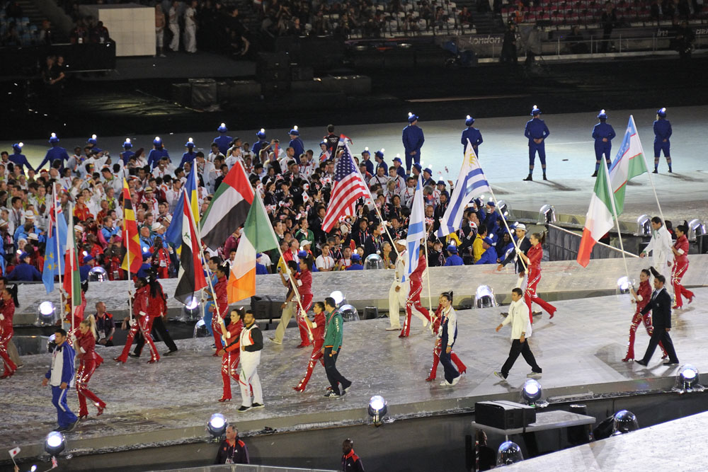 Flags are carried across the stadium during the Closing Ceremony