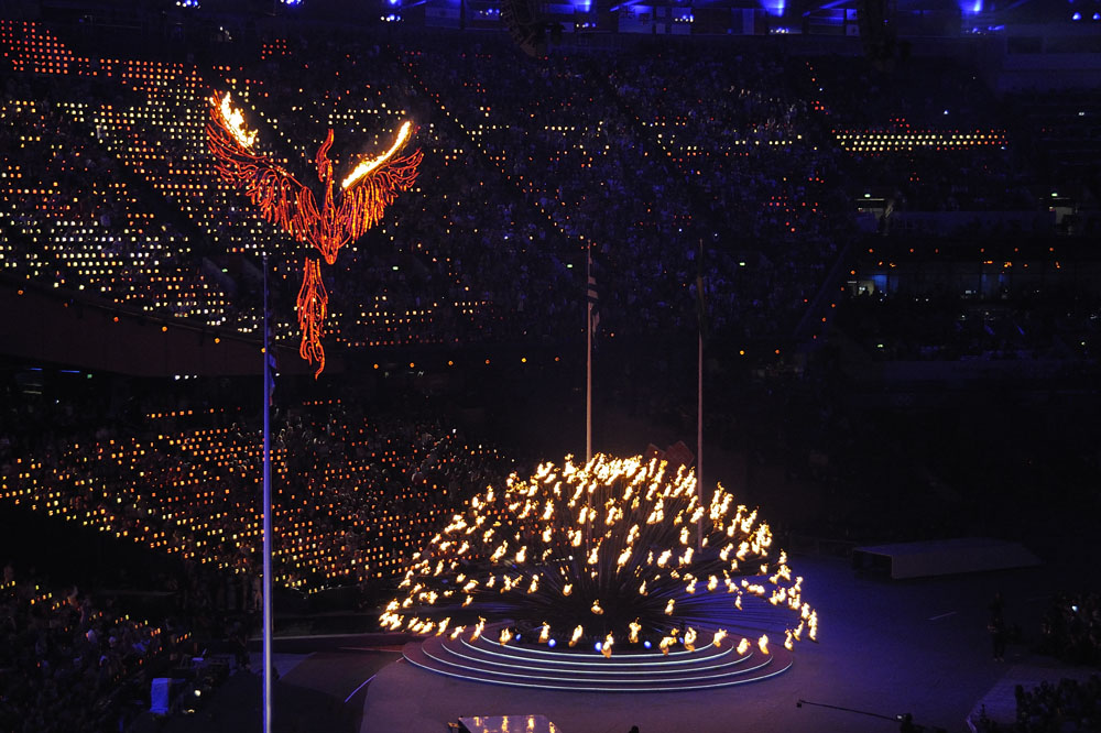 Extinguishing the Olympic flame to close the games