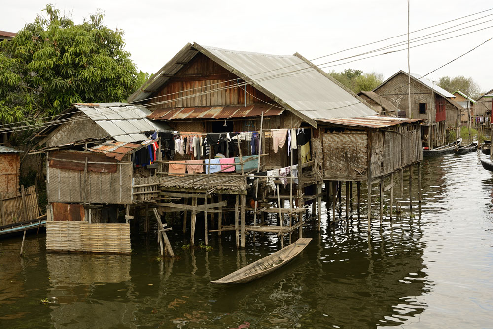 Typical house and boat on Inle Lake