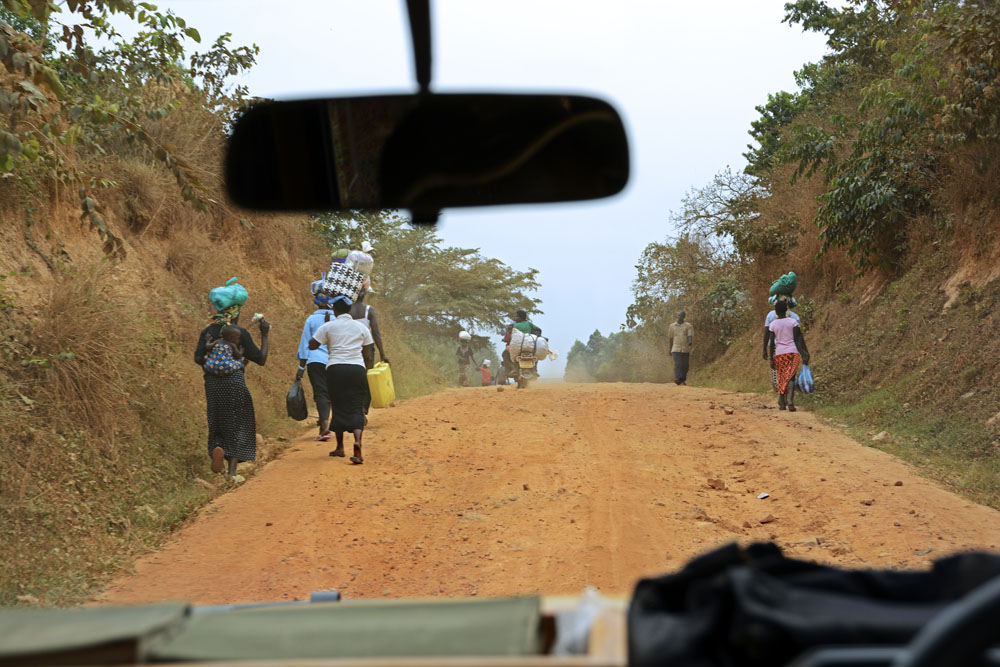 People going places on a bumpy dirt road